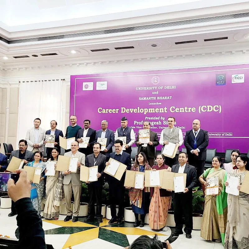 Attendees holding certificates in a group photograph at the Career Development Centre launch, Convention Hall, Vice Regal Lodge, University of Delhi.