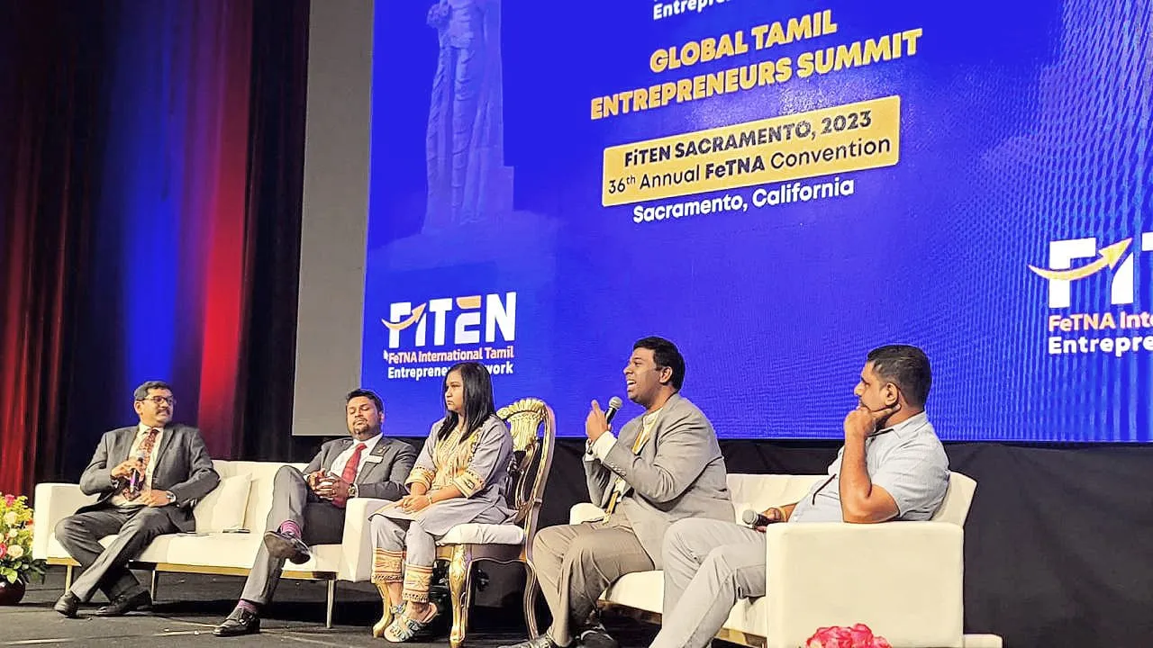 A five-member panel on stage at the Global Tamil Entrepreneurs Summit — FiTEN Sacramento 2023, held at the 36th Annual FeTNA Convention in Sacramento, California.